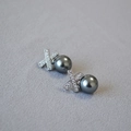 Detail of X-shaped silver earrings with micro-paved zircons and grey pearl drop - Tahitian Black (12mm)