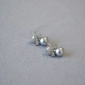 Macro shot of X-shaped zircon stud earrings with elegant grey pearls and silver pins - Silver Gray (10mm)