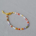 Detailed shot of multi-color square crystal beads and adjustable gold lobster clasp bracelet - Colorful Zirconia