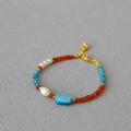 Retro handmade beaded necklace with agate and apatite on a textured grey background - Bracelet