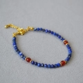 Detail of beaded necklace with blue lapis lazuli facets and red agate stones - Lapis Lazuli Agate Bracelet