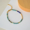Detail of bohemian turquoise and blue beaded bracelet with adjustable gold chain and clasp - Japanese Seed Beads
