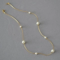 Detailed view of elegant white pearls on a minimalist golden snake chain necklace - Short Style / Approx 40-41cm