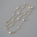 Detail of elegant gold snake chain with white pearls and adjustable lobster clasp - Long Style / Approx 88cm