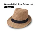 Close-up of the woven texture and black ribbon detail on a camel straw fedora hat - Adult 58cm / Camel