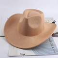 Detail shot of camel felt cowboy hat with adjustable black chin strap on a white background - Light Beige