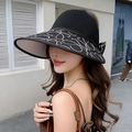 Detailed view of black knitted sun hat with wide brim, white embroidery and bow detail - Adjustable 56-59cm / Black