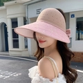Detail of pink knitted visor with wide brim, embroidery, and back bow decoration - Adjustable 56-59cm / Pink