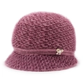 Close-up of purple knit hat for elderly women with pearl bow brooch detail - One Size / Rose Red