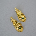 Detailed view of peacock feather gold earrings with green gemstones and small crystals - Gold