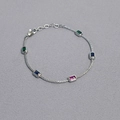 Detailed shot of brass chain necklace with colorful rectangular gemstones and lobster clasp - Platinum Plated Bracelet