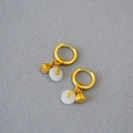 Detailed close-up of gold-plated earrings with white jade Ping'an buckle and lotus pendant - White Safety Buckle & Lotus