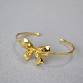 Bracelet jonc minimaliste en laiton doré orné d'un grand nœud papillon 3D poli élégant - Dorure