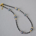 Detailed shot of baroque pearls with black spinel beads and golden bamboo spacers - Antique Gold Bamboo Short Necklace