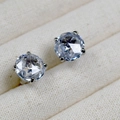 Macro shot of rose cut diamond earrings in silver four-prong setting on fabric box - Silver Four-Prong Round Zirconia Style (3)