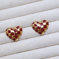 Macro shot of red and gold checkered heart earrings on a white textured jewelry tray - Red and Gold Checkerboard Heart Stud Earrings (8)