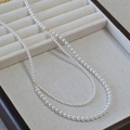 Collana a doppio filo di perle bohémien bianche lucide con chiusura dorata chic - Bianco Sporco