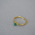 Close-up of gold plated brass ring featuring a green gemstone in a bezel setting - US 6 / Green Agate
