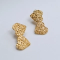 Detail of gold double heart earrings with hand-hammered texture and rustic finish - Gold Vintage Hammered Double Heart Stud Earrings (29)