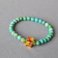 Macro detail of turquoise beaded bracelet with vintage brass floral enamel pendant - Hexagonal Star Painted Enamel Style (17)