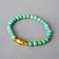 Detail of turquoise beaded bracelet featuring a gold-toned brass enamel spindle bead - Gold Spindle Enamel Accessory Bead Style (20)