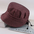 Close-up of pink and black plaid elder hat with blue sequins and adjustable drawstring - One Size / Polka Dot Pink