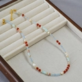 Retro asymmetric necklace with blue shoushan stones, red beads, and white pearls - Necklace