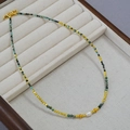 Collana di turchese africano con perline dorate e una perla d'acqua dolce centrale - Stile Collana a Perline