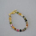 Collana con pietre semipreziose colorate irregolari e perline distanziali oro - Bracciale