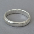 Polished silver textured wide cuff bracelet with vintage ribbed design on grey fabric - Thin Version (Tubogas Style) / Silver