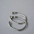 Irregular silver hoop earrings with high-polish finish and minimalist organic design - Large / White Gold