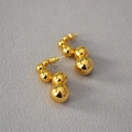Macro shot of minimalist gold plated brass S-curved earrings with five polished beads - Gold S-Shape Beaded Ball Earrings (12)