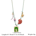 Bohemian braided teal necklace with assorted pendants and green Fatima hand tarot plate - Style 1