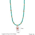 Macro detail of turquoise beads and a pink fish pendant with size measurements - Rose Quartz