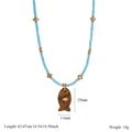 Detail of light blue beaded fish necklace with size labels 42-47cm and 25x11mm dimensions - Brown Wood Grain Style (H)