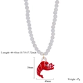 Dettaglio della collana di perle occhio di gatto con ciondolo aragosta rossa e misure - Stile Aragosta (A)
