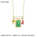 Detail of gold chain necklace with mushroom, green star plaque and red coral pendants - Mushroom and Green Tag (10-29-001)