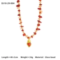 Close-up of colorful glass beaded necklace with golden heart pendant and red accent detail - Red Pink Beaded Style (10-29-004)