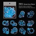 Watercolor gear stickers in blue and purple tones with gold foil laser cut details - Mechanical Player