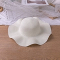 White wide-brim straw hat with wavy edges and fine woven texture for summer sun protection - M (56-58cm) / Cream
