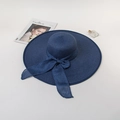 Detail of navy blue straw sun hat with large silk bow decoration and wide brim style - M (56-58cm) / Navy Blue