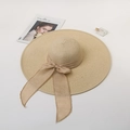Elegant wide-brim straw hat with a stylish bow ribbon on a minimalist background - M (56-58cm) / Beige