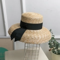 Handwoven straw sun hat with black ribbon bow in a natural beige summer style - M (56-58cm) / Natural