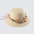 Close-up of woven straw hat featuring floral wreath and light pink chiffon ribbon - Kids 52-54 / Beige