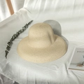 Detailed close-up of beige woven straw sun hat on a minimalist fabric surface with shadows - M (56-58cm) / Beige
