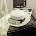 Elegant white flat top straw sun hat with black ribbon bow and metal M detail - M (56-58cm) / Bleached White