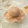 Close-up of hand-woven straw beach hat texture with elegant wavy brim and ribbon bow - M (56-58cm) / Flesh Pink