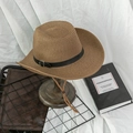 Close-up of woven straw sun hat with leather band and wooden bead chin strap - M / Coffee