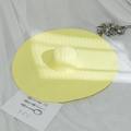 Detail shot of bright yellow wide-brim straw hat on white fabric with holiday decor - M (56-58cm) / Neon Yellow