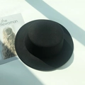 Flat top black felt fedora hat on white background with elegant geometric shadows - M (56-58cm) / Black